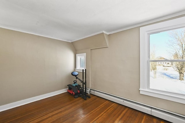 exercise room featuring a baseboard radiator, dark hardwood / wood-style floors, and ornamental molding