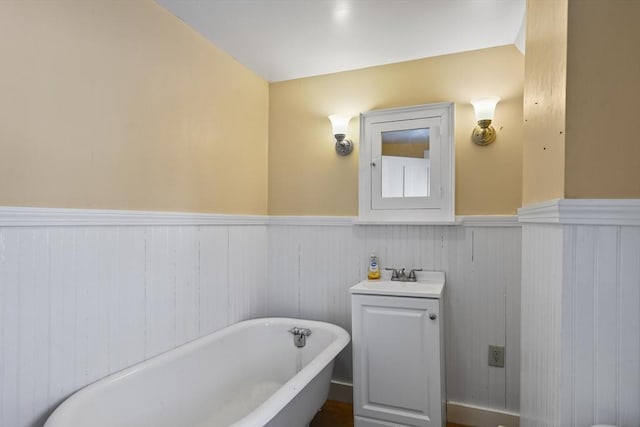 bathroom featuring vanity and a tub to relax in