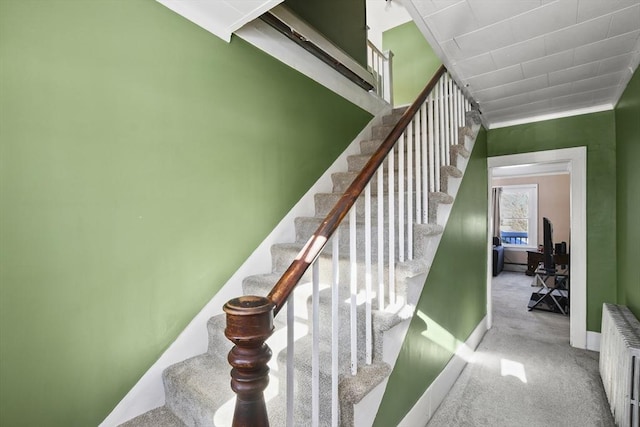 stairs with radiator and carpet