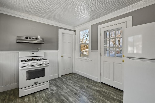 kitchen with crown molding, white appliances, dark wood-type flooring, and range hood