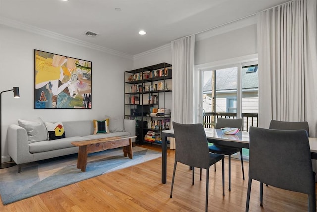 interior space with crown molding and wood-type flooring