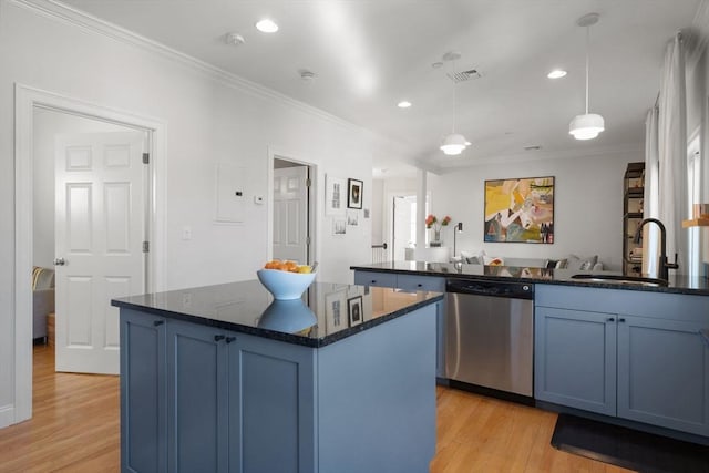 kitchen with pendant lighting, sink, a kitchen island with sink, blue cabinets, and stainless steel dishwasher