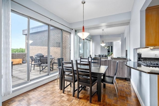 dining space featuring baseboards