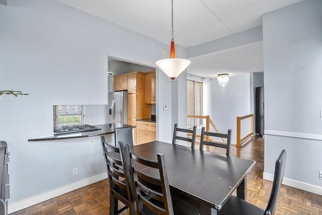 dining area with healthy amount of natural light and baseboards
