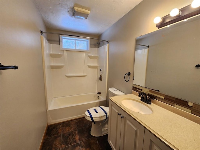 bathroom with toilet, vanity, and shower / bathtub combination