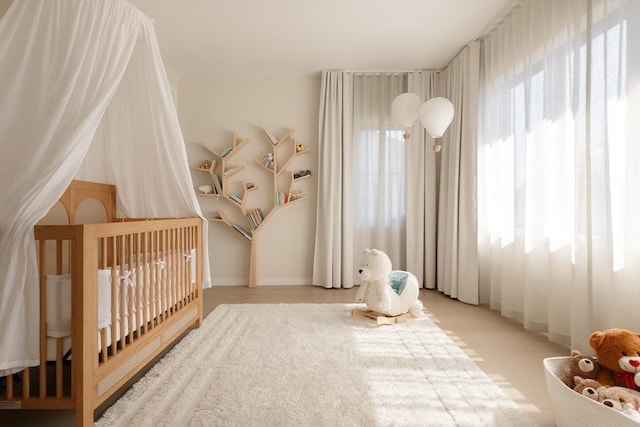 109 Wiswall Rd, Newton, MA 02459 - bedroom featuring a nursery area and baseboards