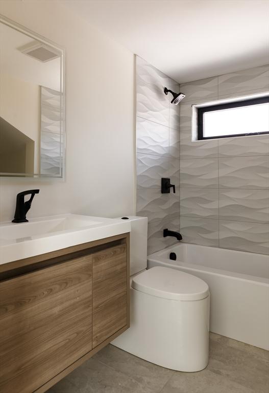 109 Wiswall Rd, Newton, MA 02459 - bathroom with bathing tub / shower combination, vanity, toilet, and tile patterned floors