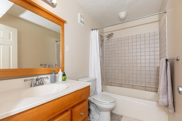 bathroom featuring vanity, tile patterned floors, shower / bath combo with shower curtain, and toilet