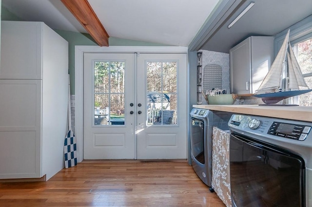 washroom with a wealth of natural light, french doors, cabinets, and light wood-type flooring