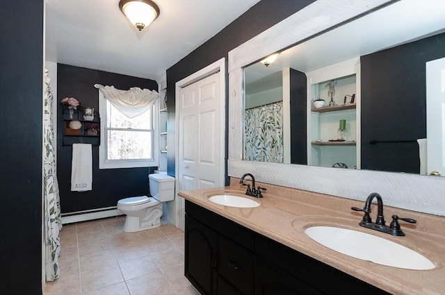 bathroom with tile patterned floors, vanity, toilet, and a baseboard heating unit