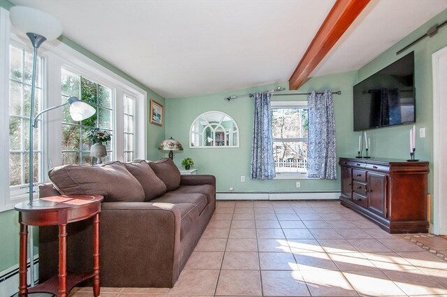 living room with baseboard heating, vaulted ceiling with beams, and light tile patterned flooring