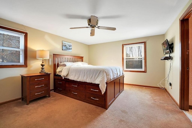 bedroom featuring ceiling fan and light colored carpet