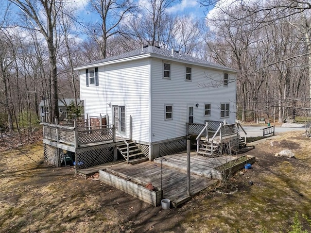 back of property with a wooden deck