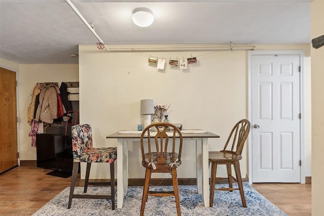 200 Market St Unit 44B, Lowell, MA 01852 - dining area featuring wood finished floors and baseboards