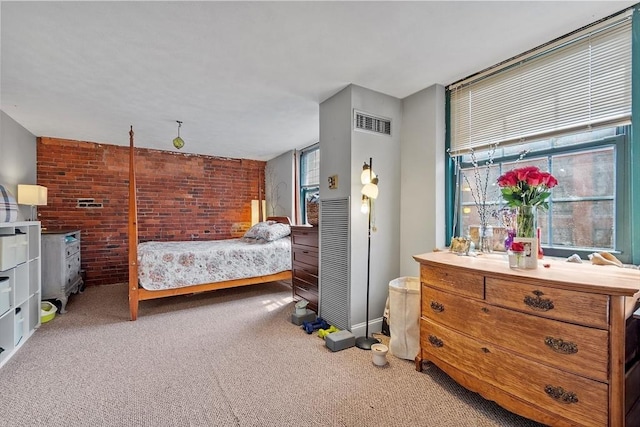 200 Market St Unit 44B, Lowell, MA 01852 - bedroom featuring carpet flooring, brick wall, and baseboards