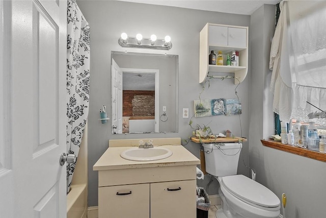 200 Market St Unit 44B, Lowell, MA 01852 - bathroom featuring vanity, toilet, shower / tub combo with curtain, and baseboards
