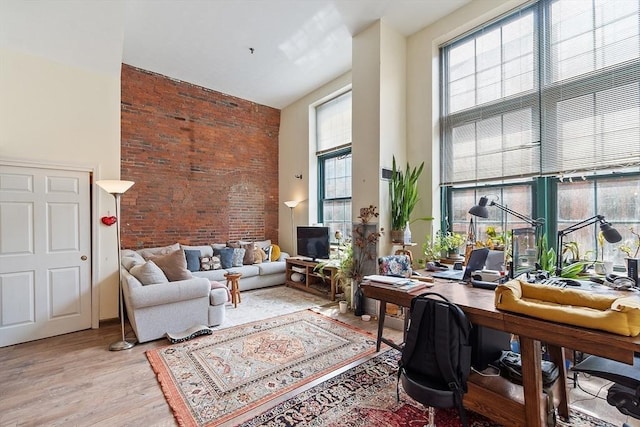 200 Market St Unit 44B, Lowell, MA 01852 - office area featuring a high ceiling, plenty of natural light, and light wood-style floors