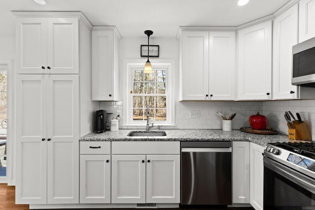 kitchen with stainless steel appliances and white cabinets