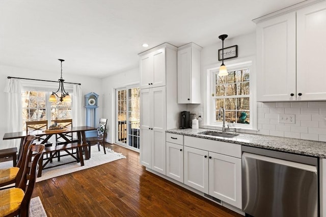 kitchen featuring a sink, plenty of natural light, dark wood-style flooring, and dishwasher