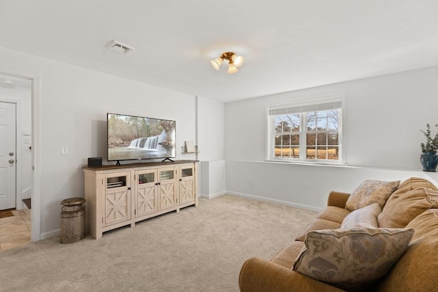 living room featuring baseboards, visible vents, and light colored carpet