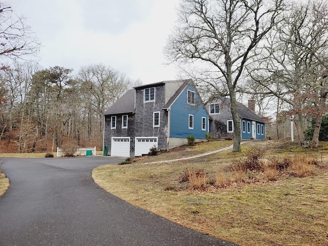 view of front of property featuring an attached garage and driveway