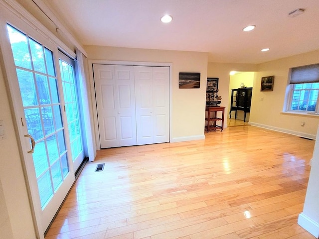 interior space featuring recessed lighting, visible vents, and light wood-style floors