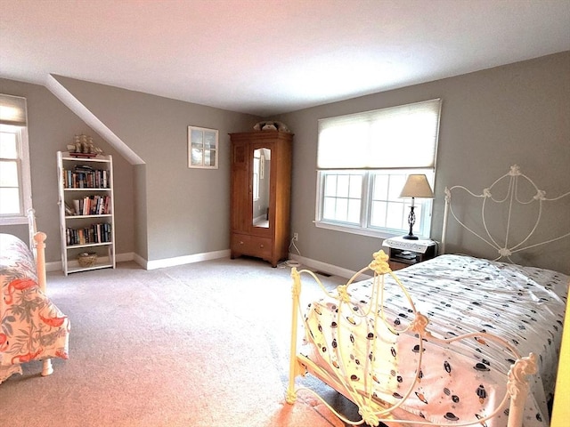 carpeted bedroom with baseboards