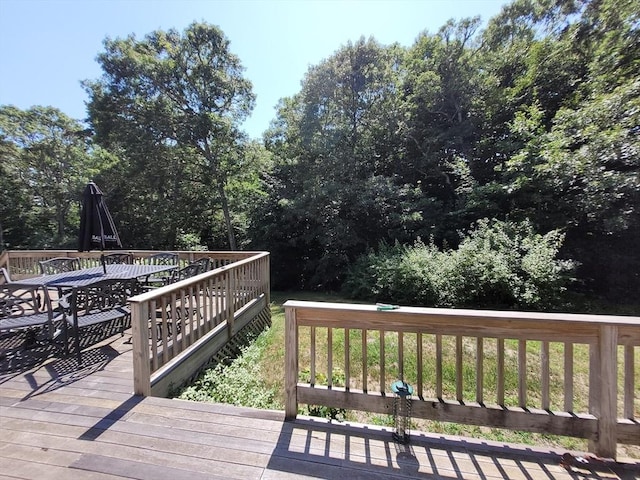 wooden deck featuring outdoor dining space