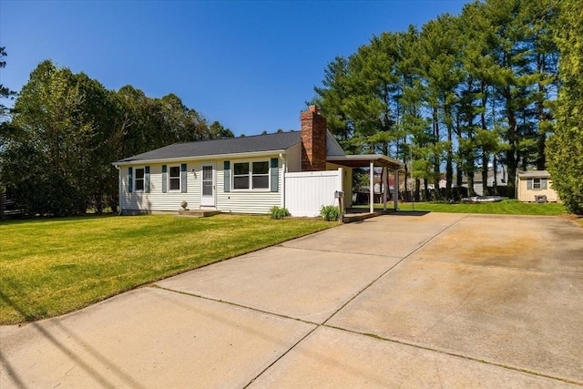 single story home featuring a front lawn, fence, and a chimney