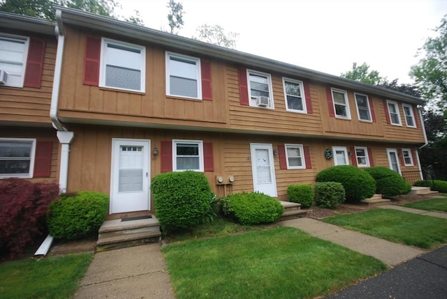 343 Chicopee St Unit 41, Chicopee, MA 01013 - townhome / multi-family property with entry steps, board and batten siding, cooling unit, and a front yard