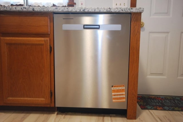 343 Chicopee St Unit 41, Chicopee, MA 01013 - kitchen view of dishwasher and brown cabinetry