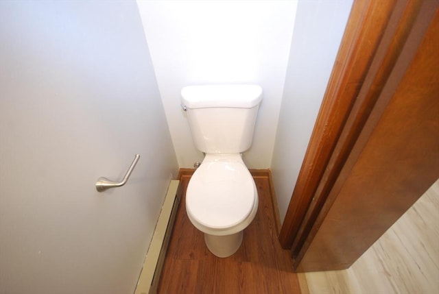 343 Chicopee St Unit 41, Chicopee, MA 01013 - bathroom with toilet, a baseboard radiator, and wood finished floors
