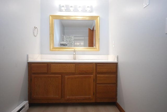 343 Chicopee St Unit 41, Chicopee, MA 01013 - bathroom with a baseboard radiator and vanity