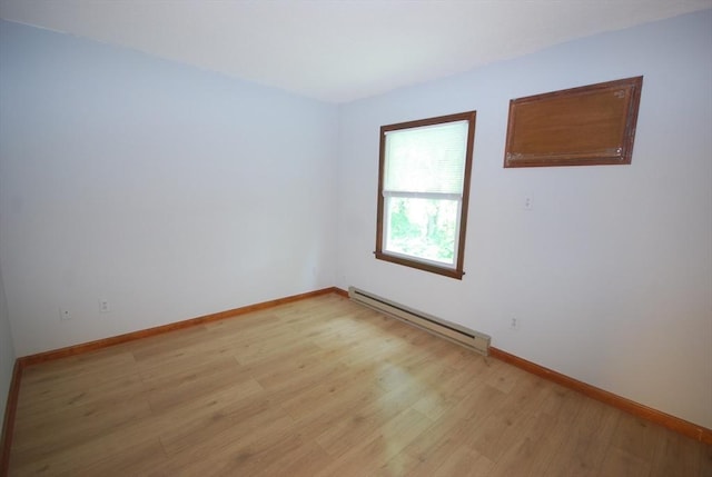 343 Chicopee St Unit 41, Chicopee, MA 01013 - empty room with baseboard heating, light wood-type flooring, and baseboards