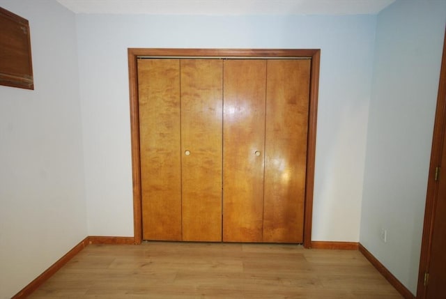 343 Chicopee St Unit 41, Chicopee, MA 01013 - unfurnished bedroom featuring light wood-type flooring, baseboards, and a closet