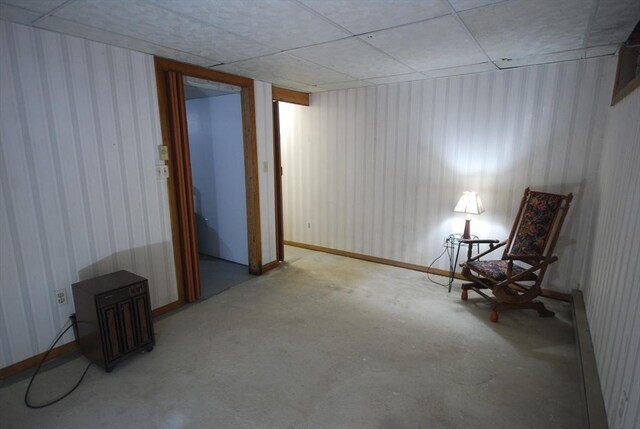 343 Chicopee St Unit 41, Chicopee, MA 01013 - unfurnished room with concrete floors, a paneled ceiling, and wallpapered walls