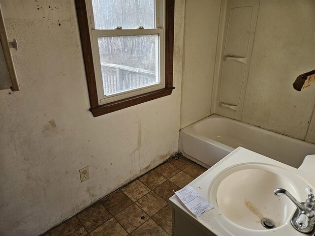 bathroom with a bath and a sink
