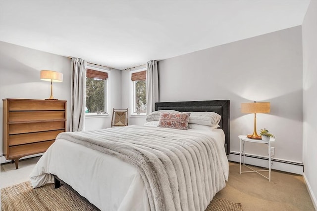 bedroom featuring a baseboard radiator, light carpet, and baseboards