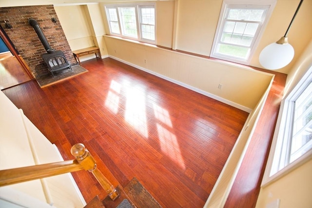 38 Kimball Beach Rd, Hingham, MA 02043 - living area featuring a wood stove, wood finished floors, and baseboards