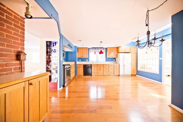 38 Kimball Beach Rd, Hingham, MA 02043 - kitchen with appliances with stainless steel finishes, a chandelier, light wood finished floors, light countertops, and pendant lighting