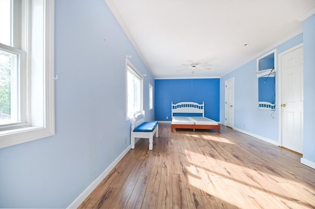 38 Kimball Beach Rd, Hingham, MA 02043 - unfurnished bedroom featuring ornamental molding, baseboards, hardwood / wood-style flooring, and a ceiling fan