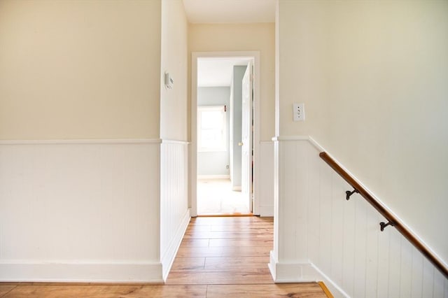 38 Kimball Beach Rd, Hingham, MA 02043 - corridor with a wainscoted wall, light wood-style floors, and an upstairs landing