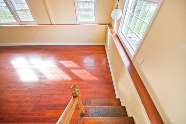 38 Kimball Beach Rd, Hingham, MA 02043 - stairs with healthy amount of natural light, wood finished floors, and baseboards