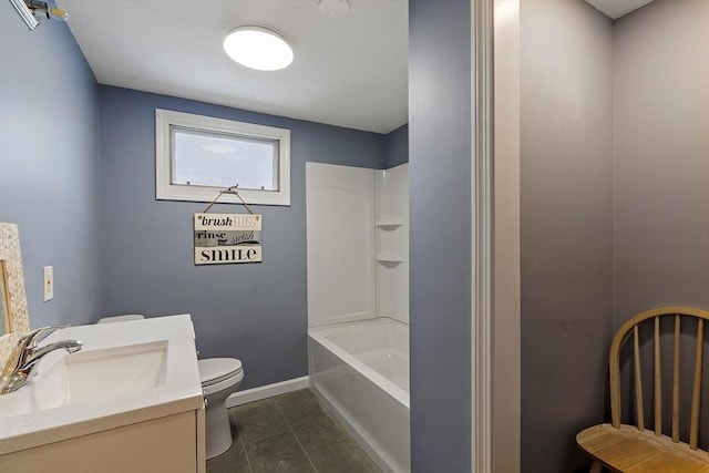 full bath featuring toilet, vanity,  shower combination, tile patterned flooring, and baseboards