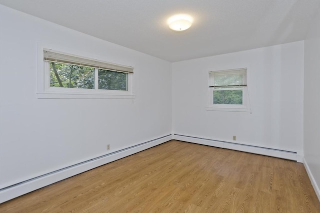 83 Horseshoe Dr Unit 83, Chicopee, MA 01022 - empty room featuring light wood-style floors, a baseboard radiator, and baseboard heating