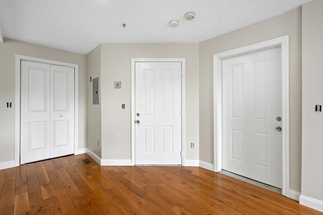 72 River St Unit 2, Haverhill, MA 01832 - entryway featuring baseboards, hardwood / wood-style floors, and electric panel