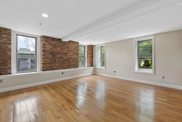 72 River St Unit 2, Haverhill, MA 01832 - empty room with light wood-type flooring, healthy amount of natural light, and baseboards