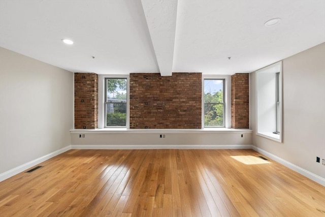 72 River St Unit 2, Haverhill, MA 01832 - spare room with baseboards, light wood-type flooring, and healthy amount of natural light