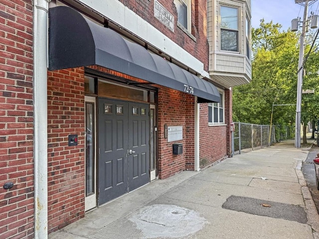 72 River St Unit 2, Haverhill, MA 01832 - doorway to property featuring brick siding