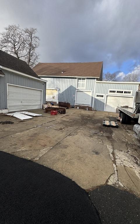 view of front of property with an outbuilding and a garage